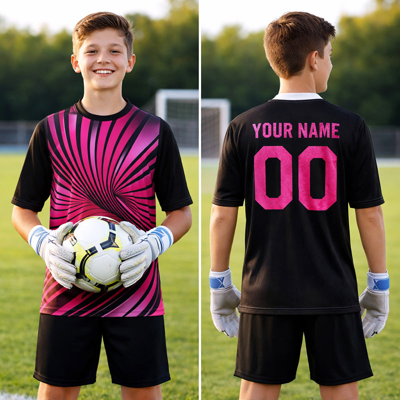 Pink black goalkeeper jersey with black shorts on a boy